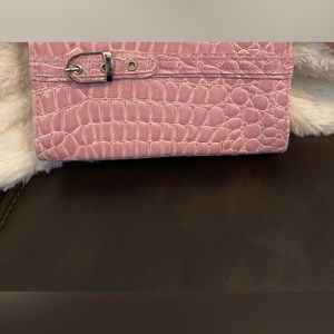 Clutch purse, pink croc with top zipper and silver buckle detail. Approx 5” x 7”